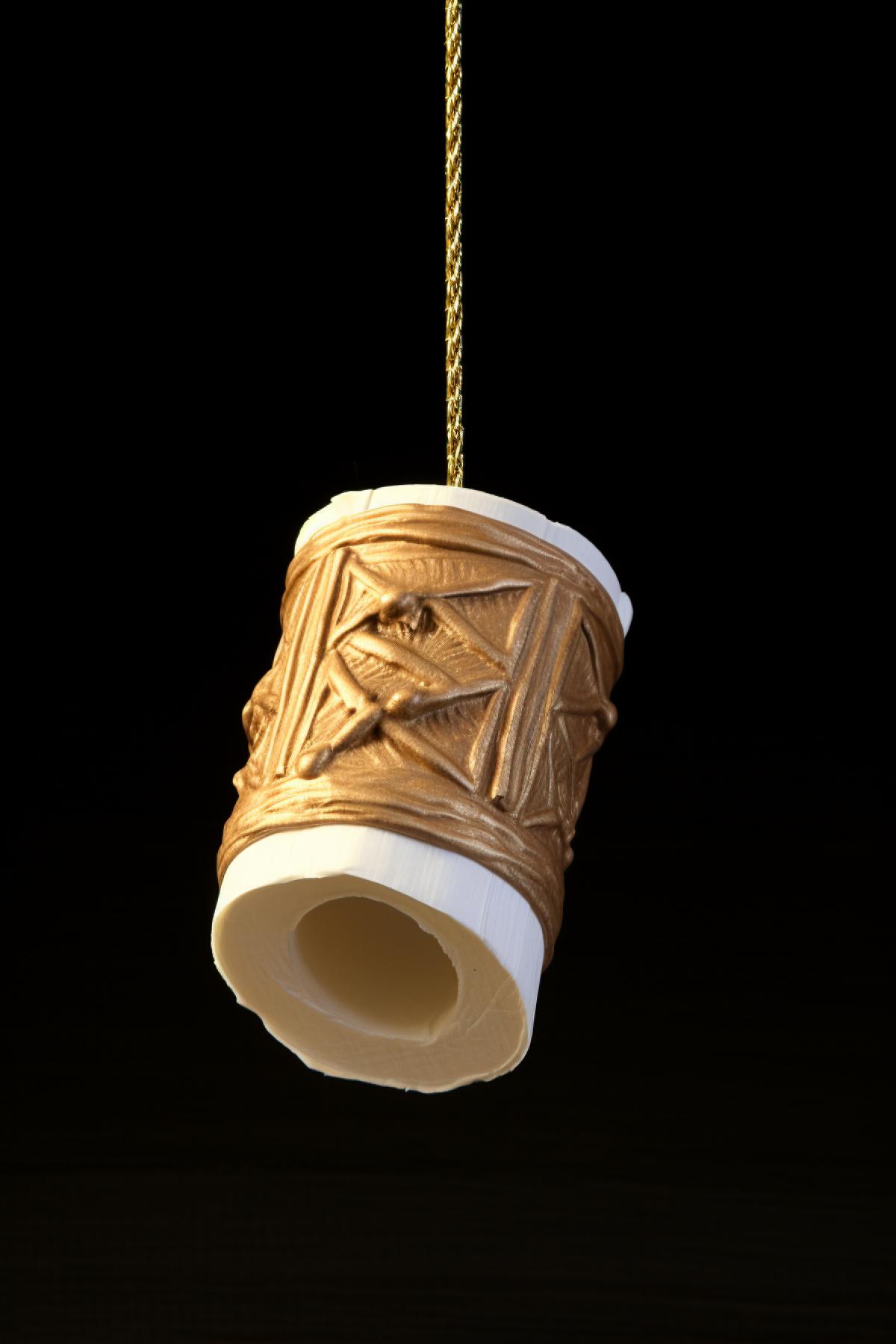 Precious pendant in the form of a toilet paper roll, photorealism