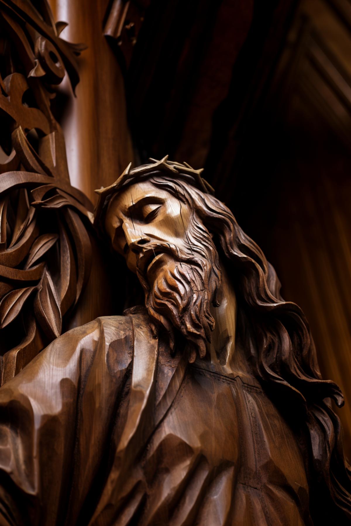 Wooden sculpture of Jesus Christ Northern Russia architecture suffering face pain hopelessness detailed photo