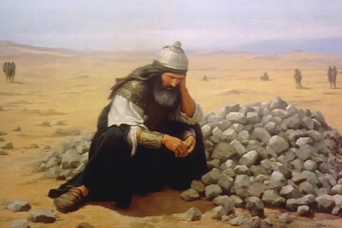 Tamerlane kneels in front of a huge pile of stones in the steppe and cries.