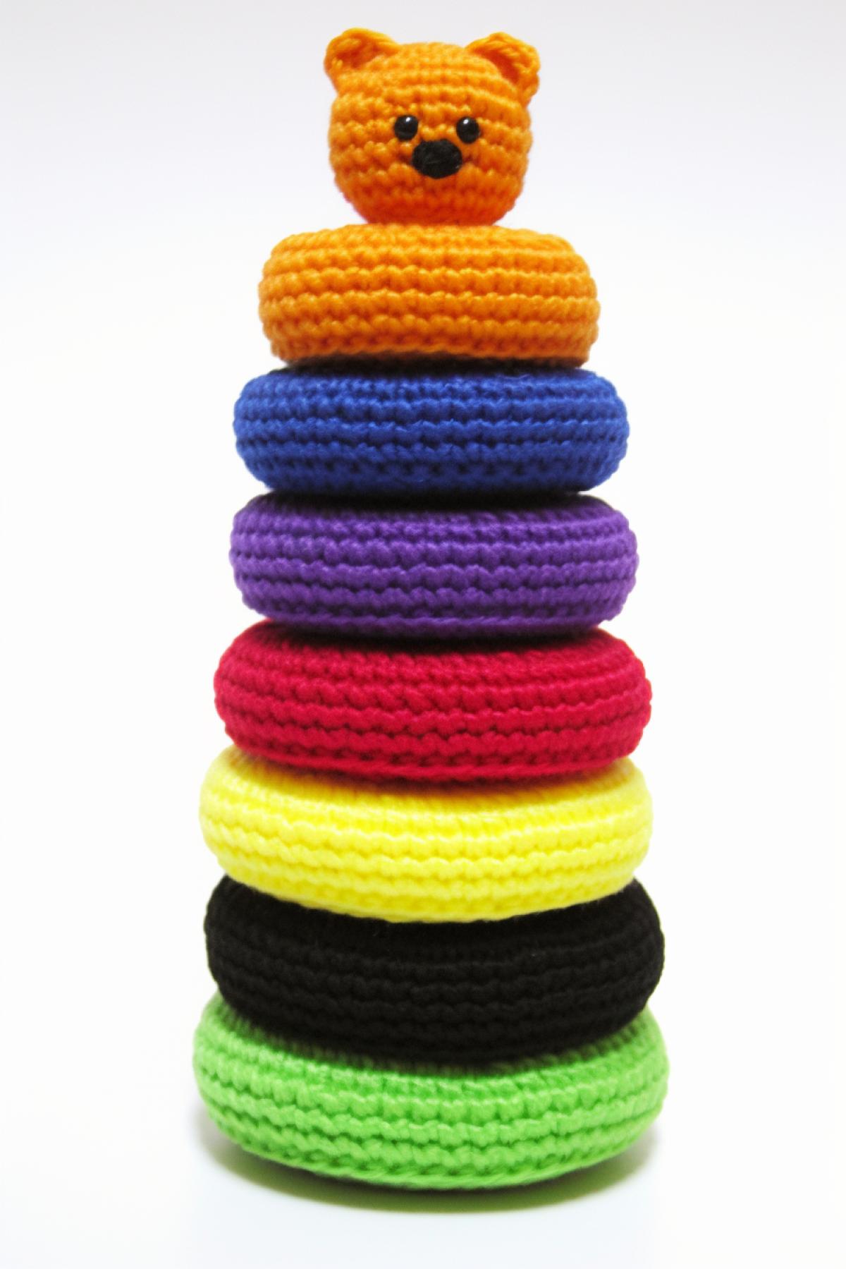 amigurumi style, granny knitting a giant teddy bear of Plush yarn Alize Puffy, bright colors, realistic, warm atmosphere