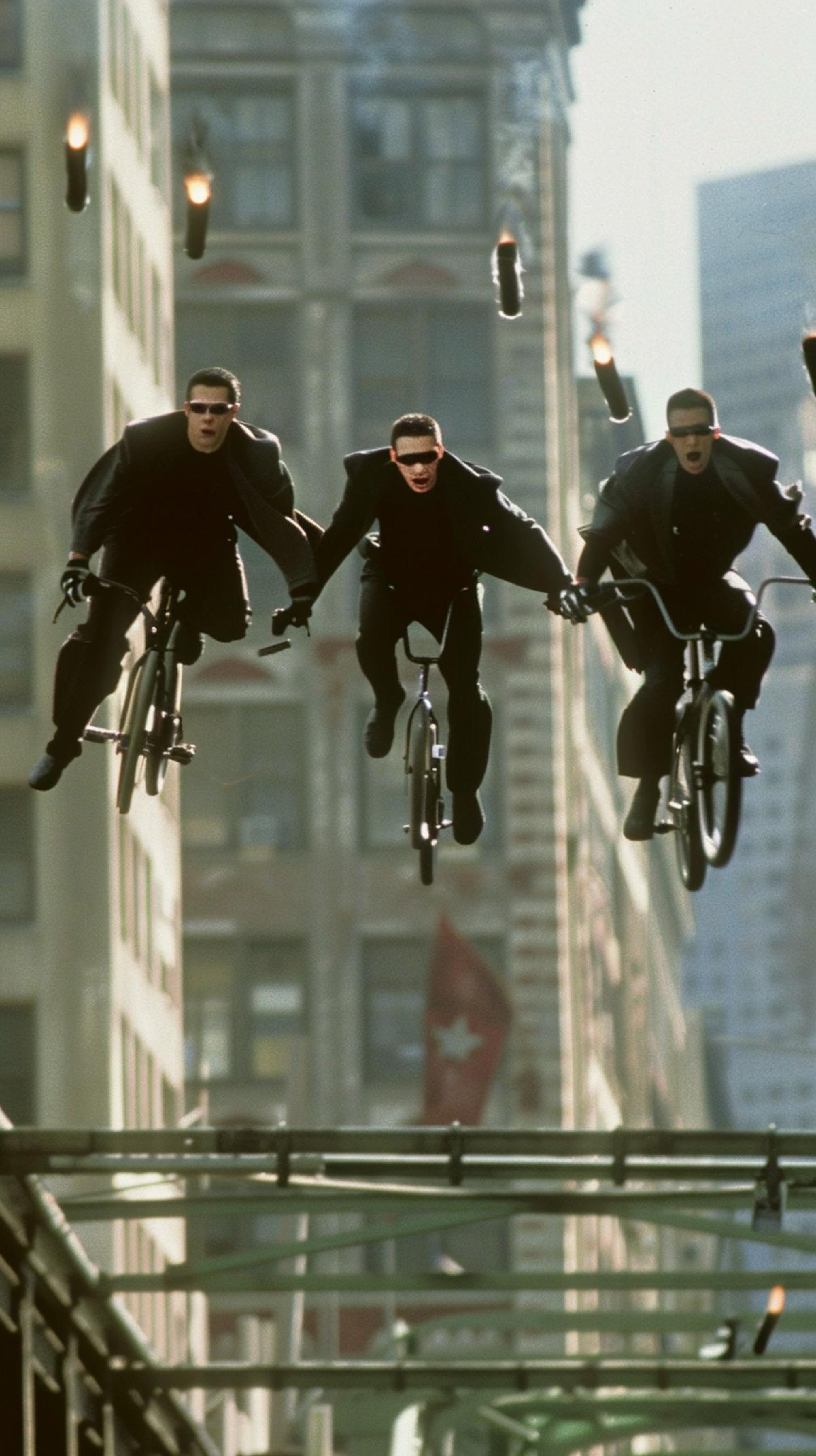 The cyclists in the film Matrix dodge bullets while jumping