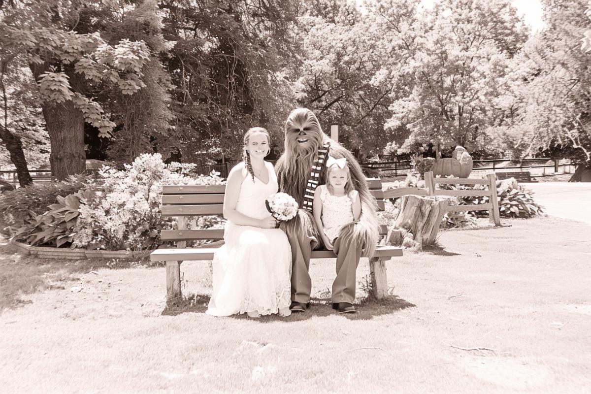 Star Wars character Chewbacca with his wife and daughter, who have braids, ribbons and bows in their hair, happiness, joy