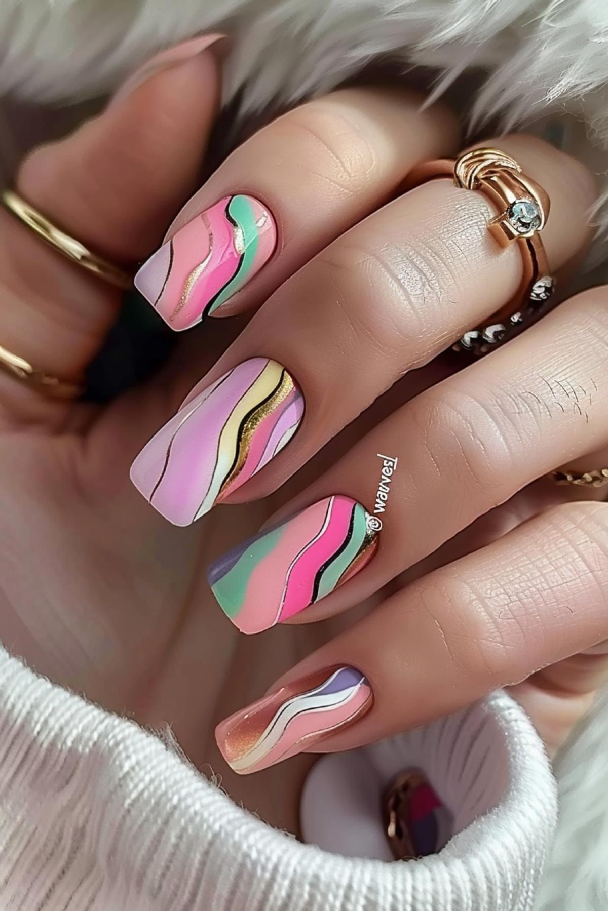 Summer manicure \"waves\" with a golden gradient, delicate pastel colors with waves of color transition