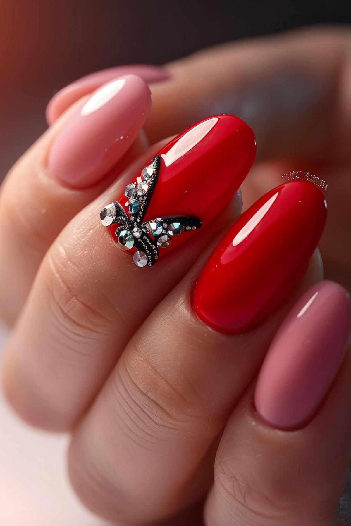 Bright red manicure, one nail is painted pink, and a butterfly made of small shiny rhinestones is laid out on the pink one.
