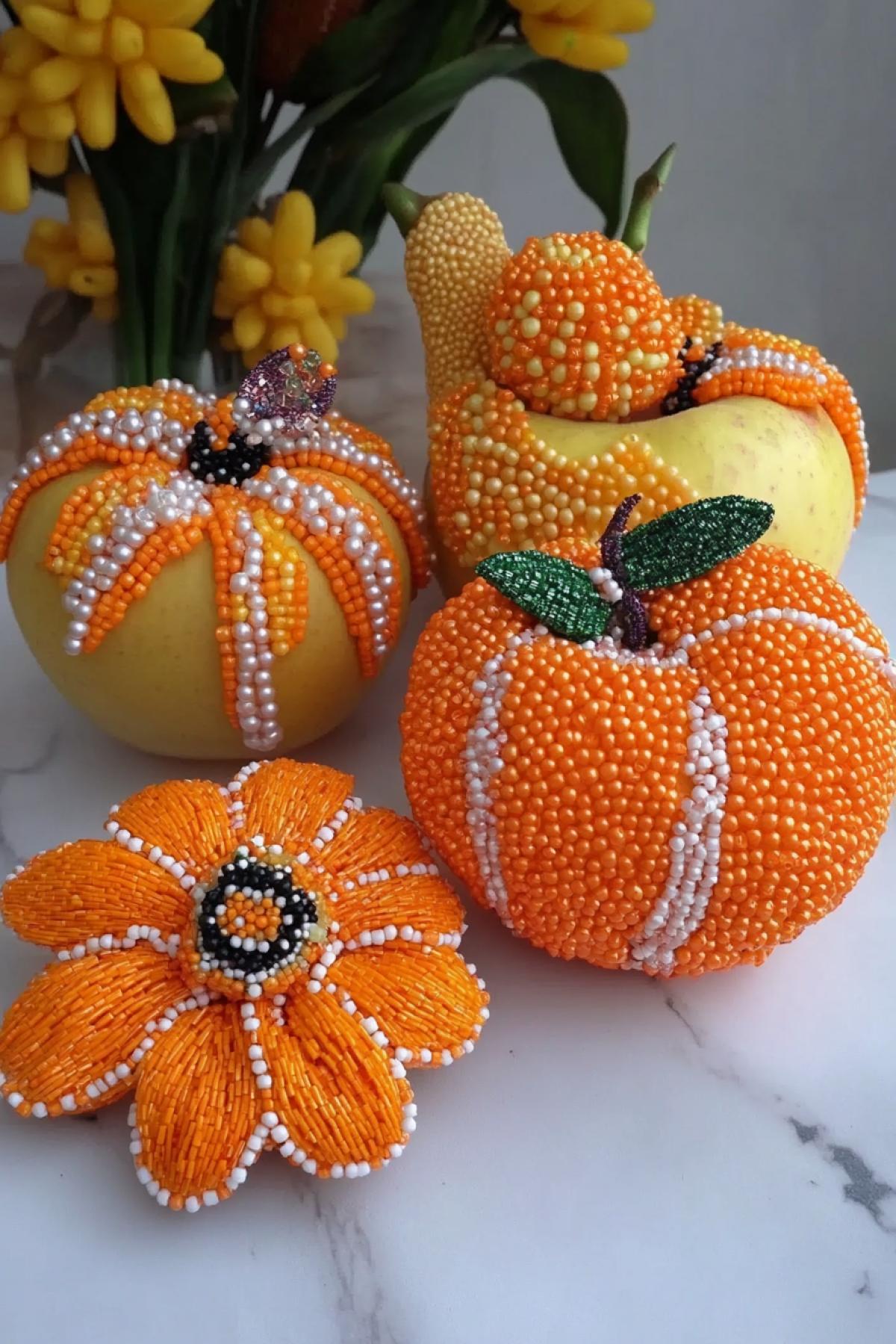 Beautiful presentation of fruits decorated and made of beads, apple, tangerine peels, banana