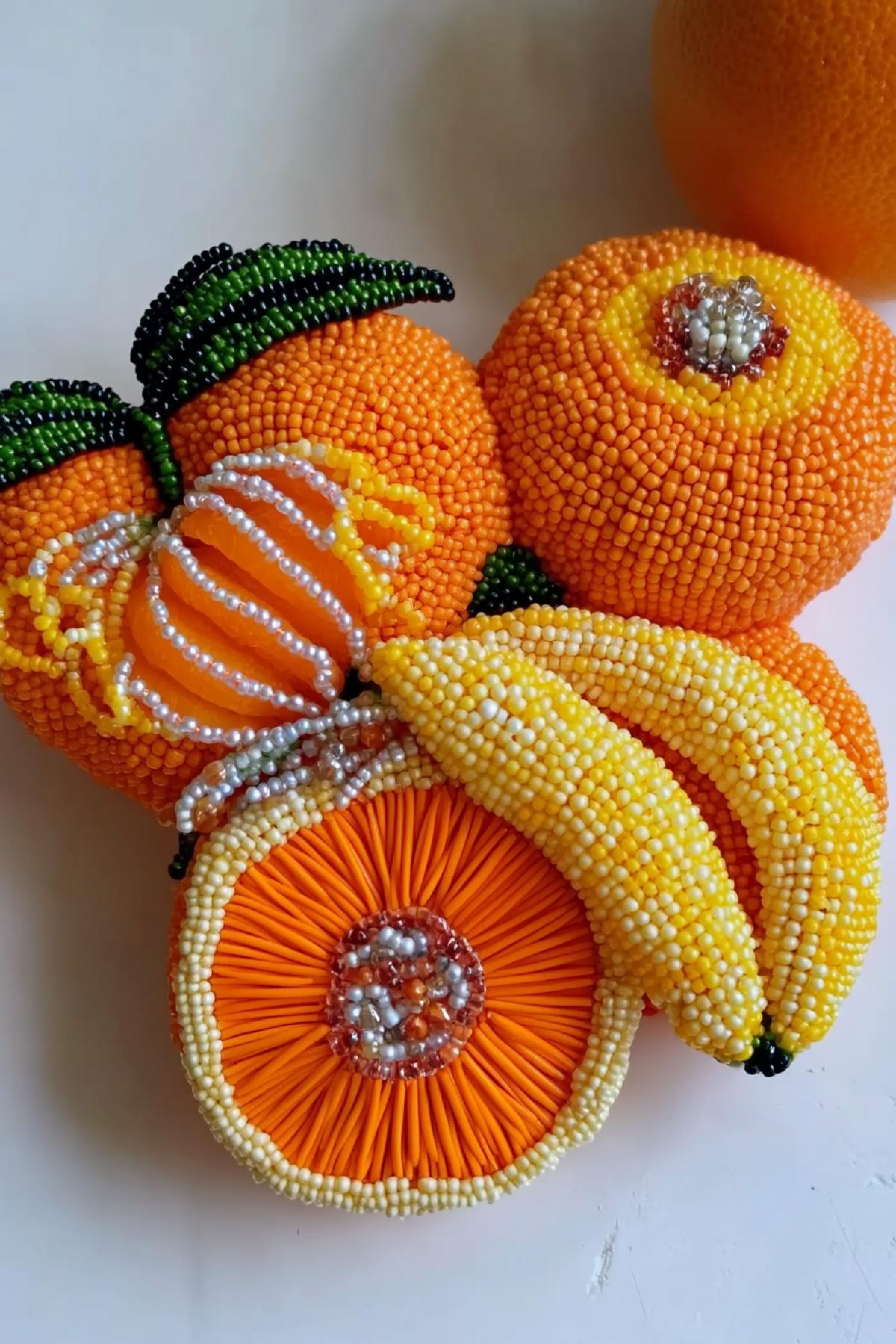 Beautiful presentation of fruits decorated and made of beads, apple, tangerine peels, banana