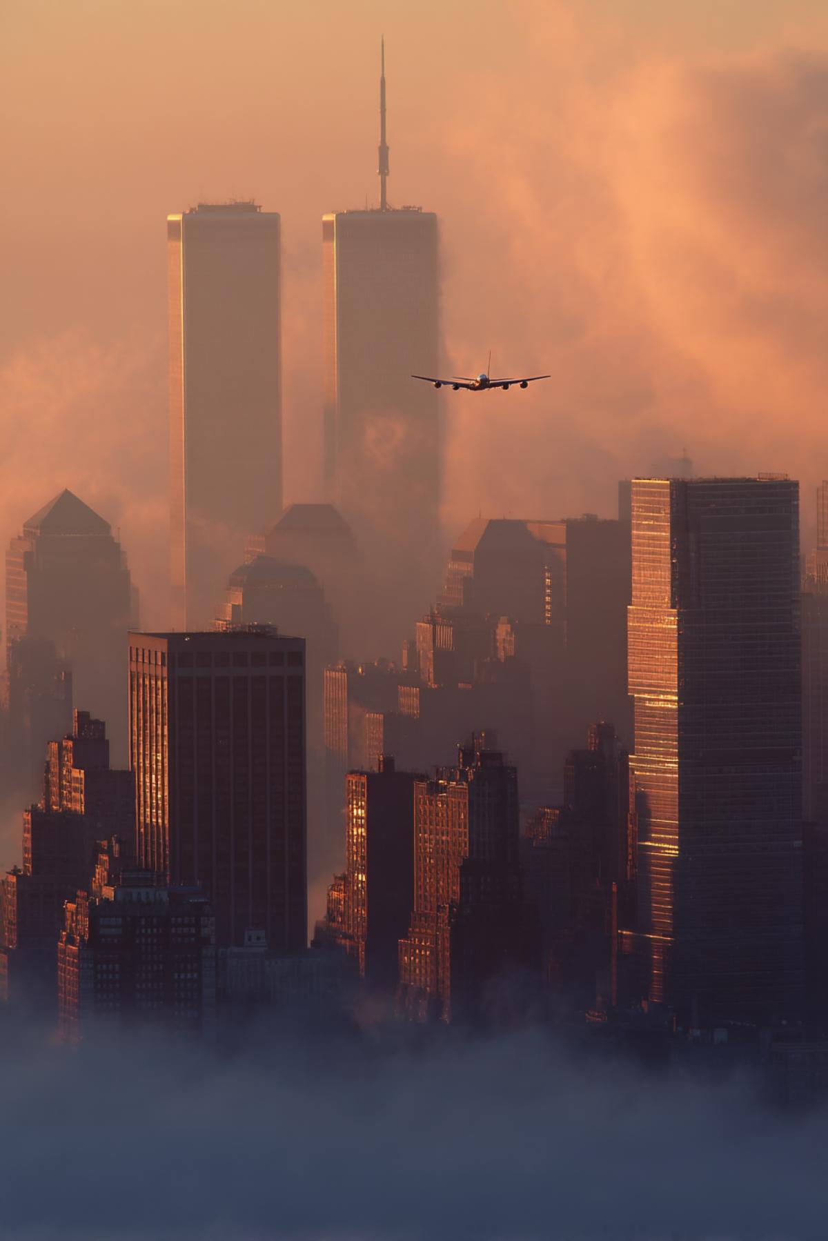 Sight from edge of roof of the highest skyscraper at international trade centre Manhattan early morning nine-eleven and aircraft approaches to crush into twin tower atmosphere of inevitable catastrophe