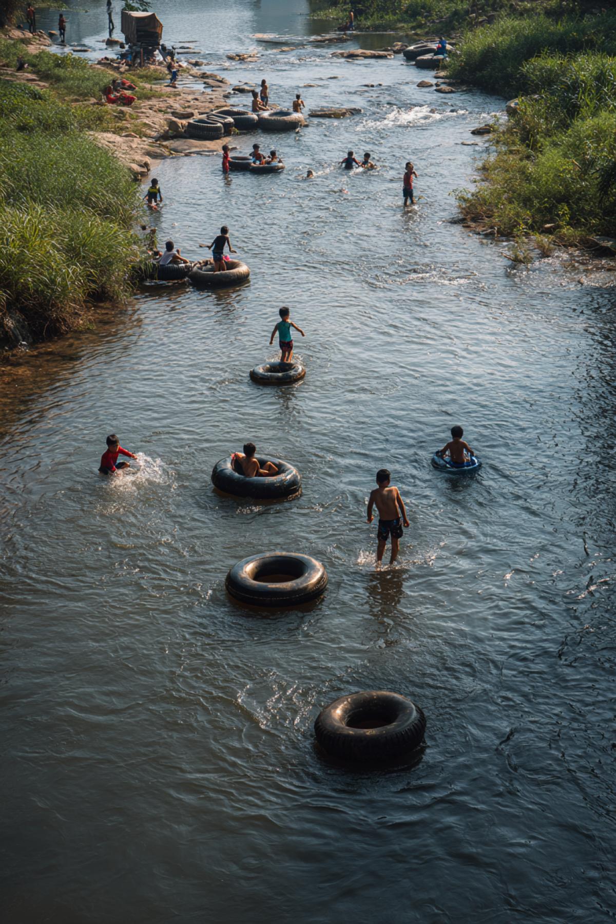 The children are swimming in the river using inflated car inner tubes.