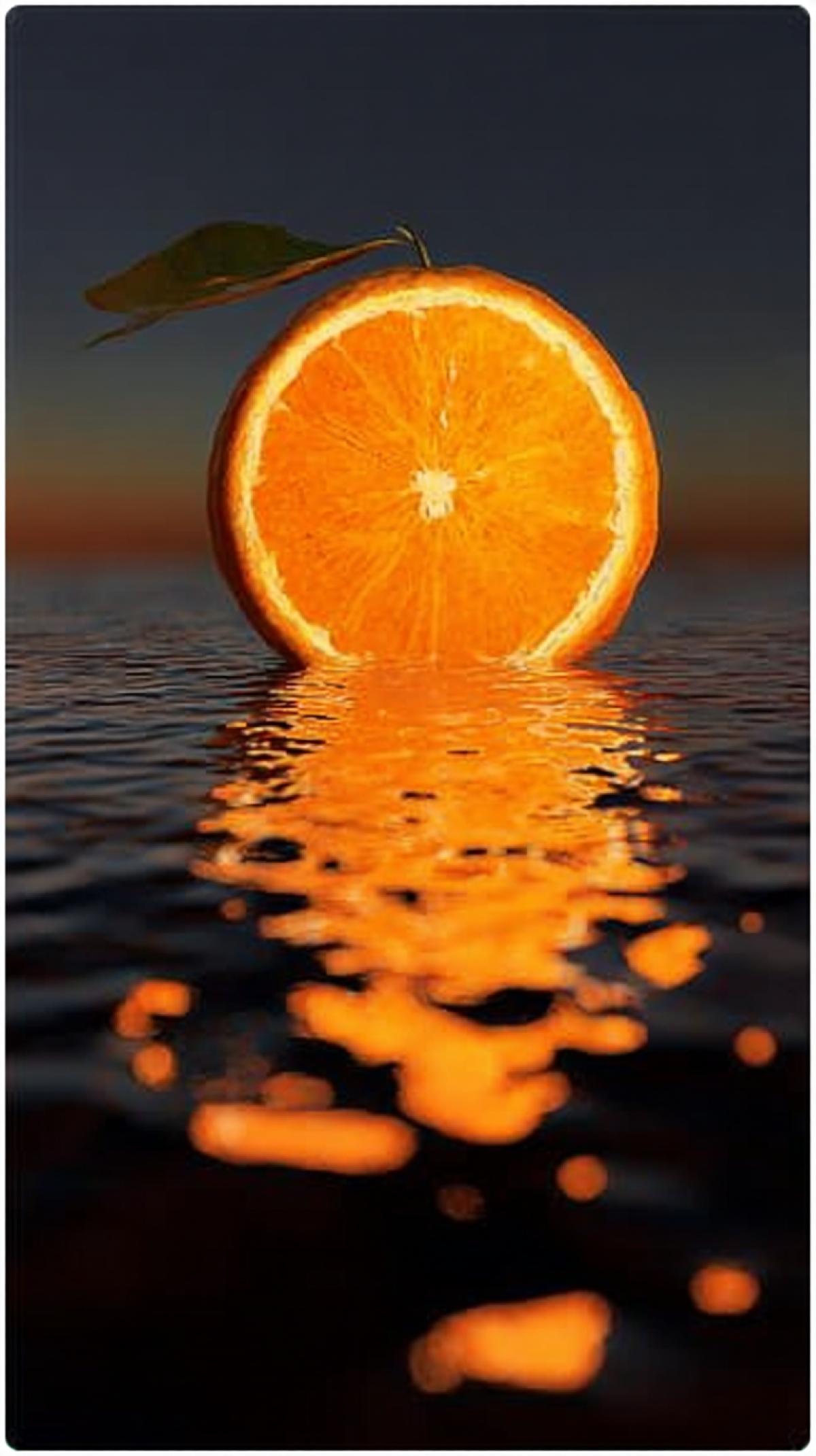 An orange at sunset