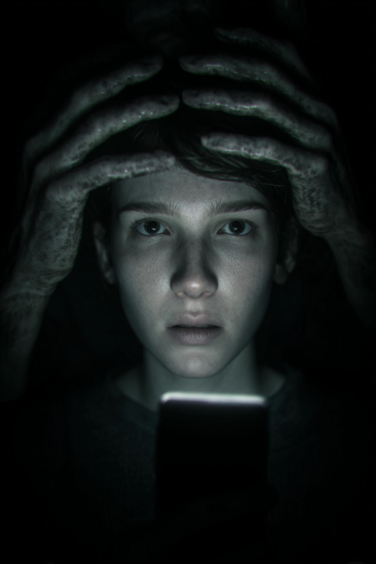 A hyperrealistic, unsettling scene in a pitch-dark bedroom at 3 AM. The only light source is the faint glow of a smartphone screen, illuminating a persons face frozen in silent, wide-eyed terror. In the absolute darkness behind them, two perfectly human-like hands are slowly emerging from the shadows, poised to cover the persons eyes. The atmosphere is thick with dread, cinematic chiaroscuro lighting, 32mm film grain, palpable tension, a moment of pure, primal horror.