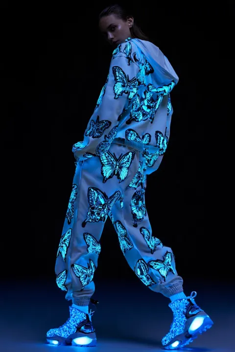 woman Bioluminescent Christmas themed tracksuit for girls that looks realistic and professional