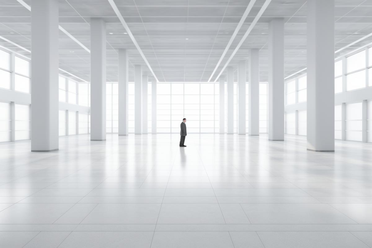 Lonely frightened man in a white empty room